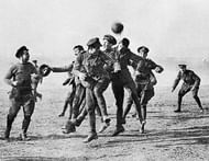 Soldiers from the opposing German and British forces play a game of football on Christmas day 1914(credit: soulofagardner.wordpress.com)
